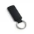 A black, blank premium leather keyholder before customisation, showcasing the raw stitching and thick leather grain on a wooden workshop table by WIKXY.