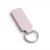 A pink colour, blank premium leather keyholder before customisation, showcasing the raw stitching and thick leather grain on a wooden workshop table by WIKXY.