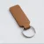 coffee-brown-laser-engraved-leather-keyholder-rectangular-shape Brown leather keyring with a stitched rectangular fob and silver metal ring