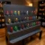 4-level-display-shelf Rows of colourful character figurines displayed on a tiered stand in a room