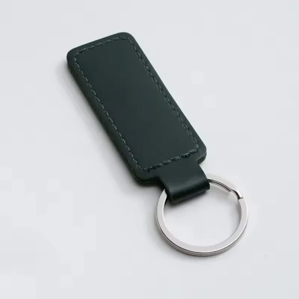 laser-engraved-leather-keyholder-rectangular-shape-dark-green Dark Green leather keyring with a stitched rectangular fob and silver metal ring