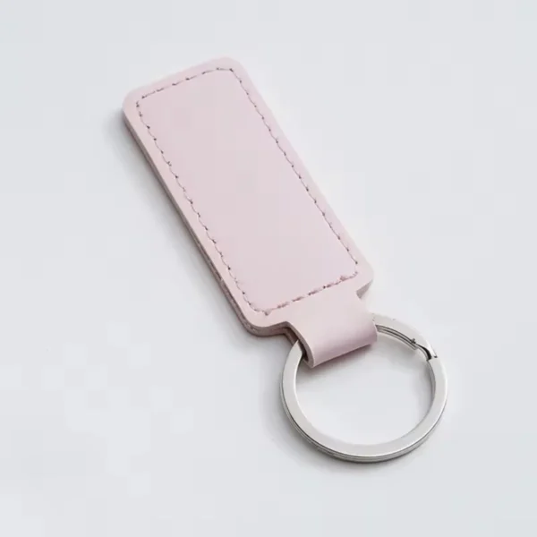 laser-engraved-leather-keyholder-rectangular-shape-light-pink Pink rectangular leather keyring with a silver metal ring